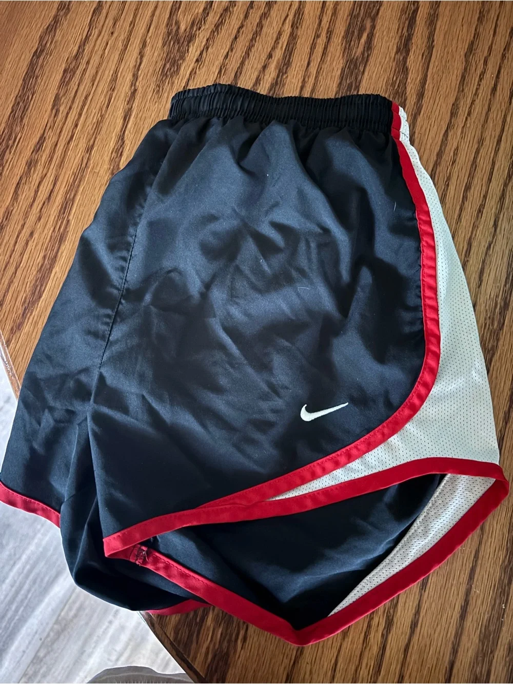 Nike Black Athletic Shorts with Red Trim and White Panels